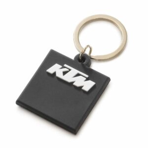 Llavero negro de goma KTM: Pasión en cada detalle. Logo y lema "READY TO RACE". Un accesorio emblemático para los amantes de la velocidad.